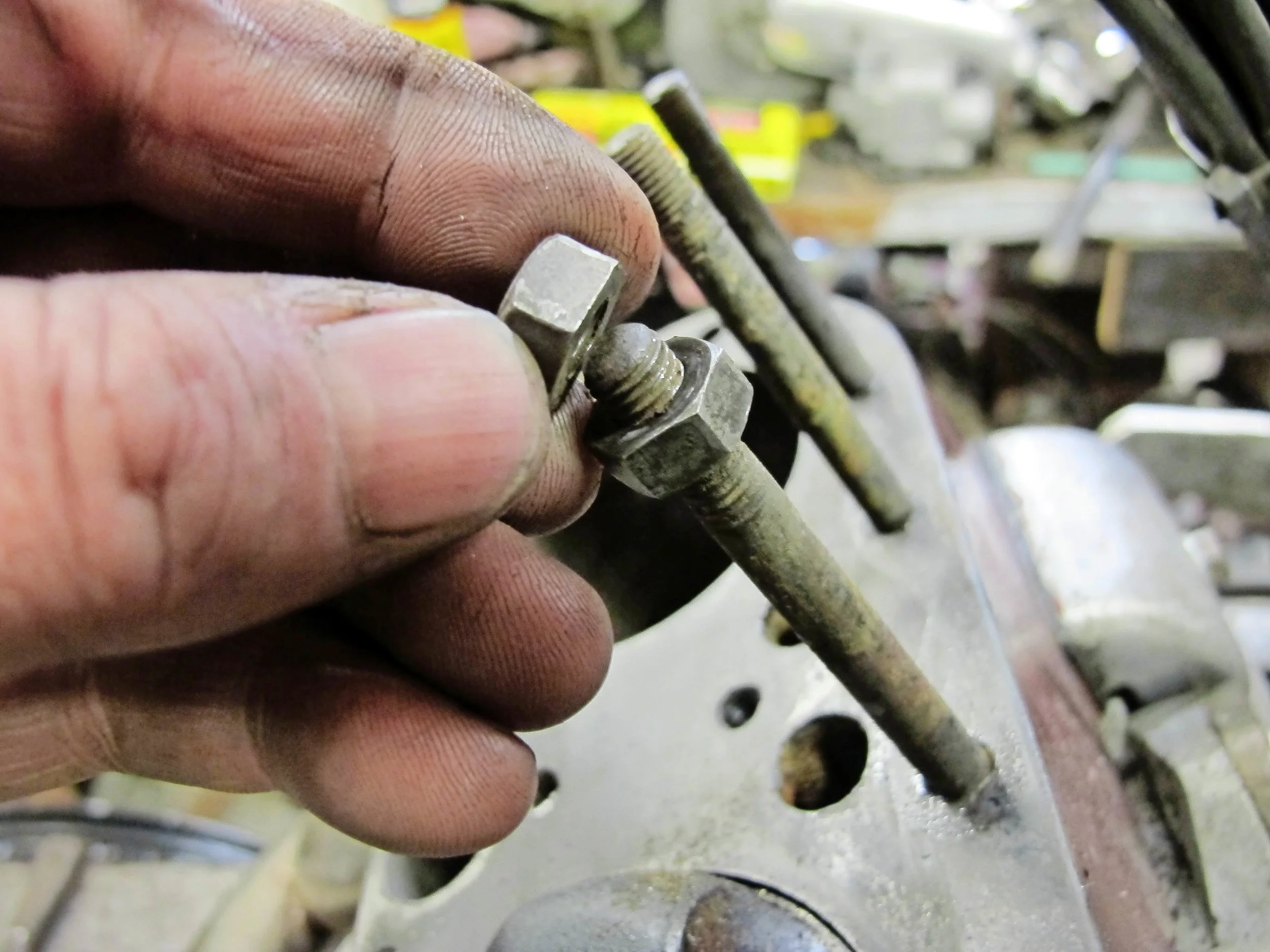 2. Wind two nuts onto the thread; there’s usually enough for two nuts. You want as much thread contact as possible.