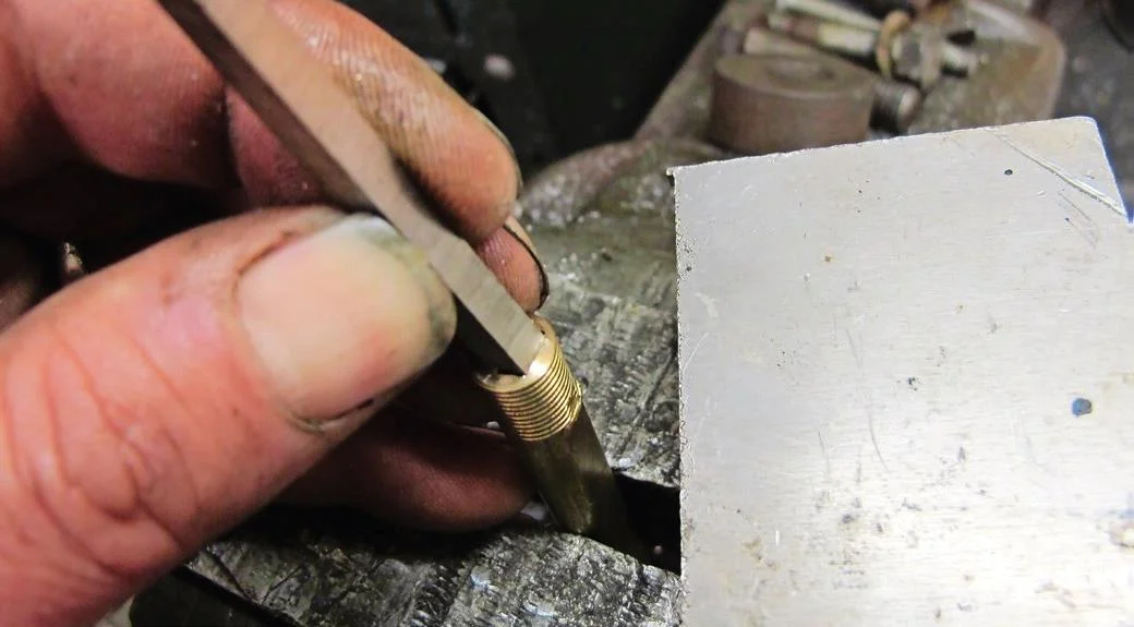 3. Use the chisel edge and a soft hammer to pare away inside the hole, forming the four corners that make it into a square.