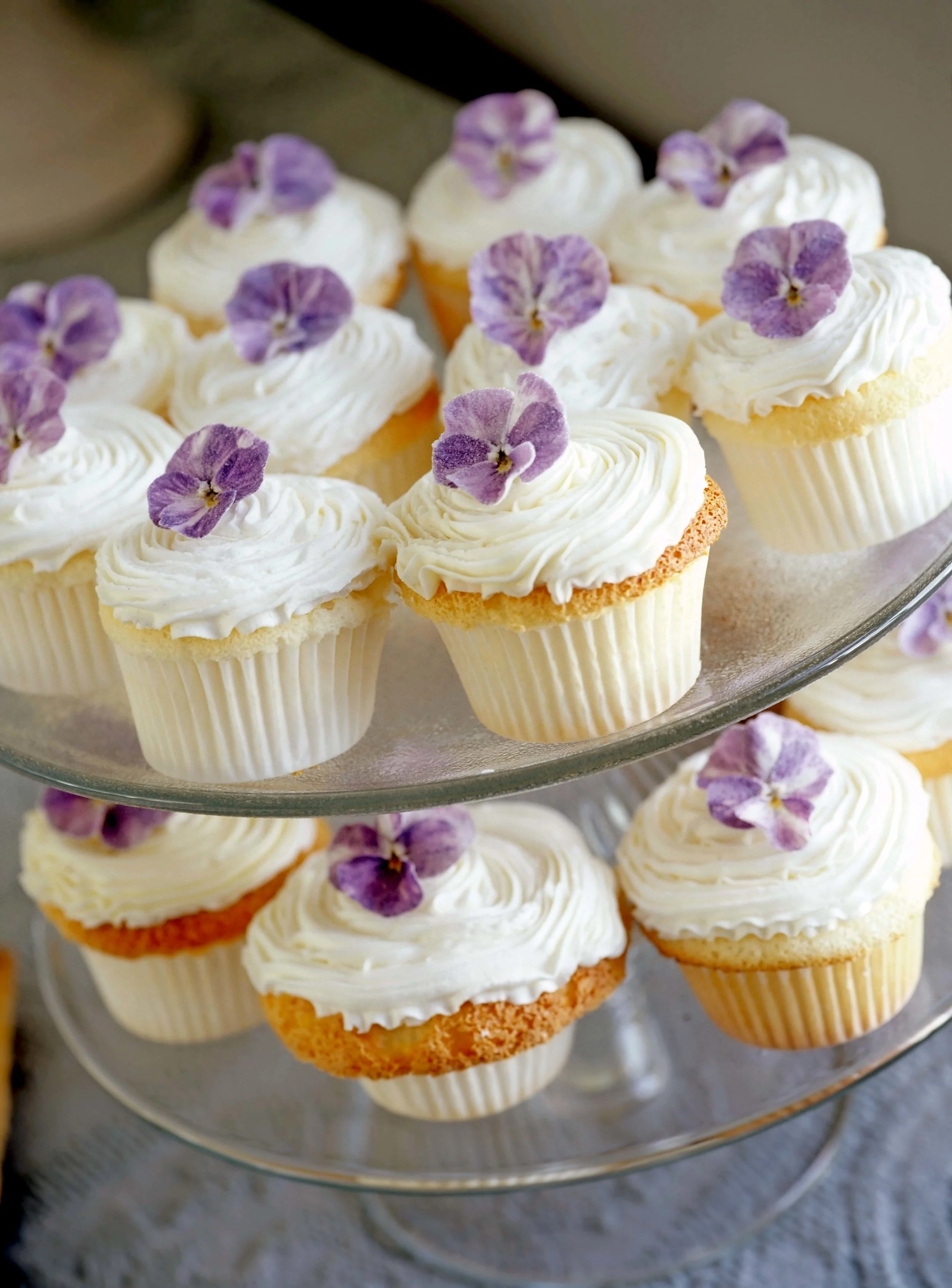 Sugared viola flowers add a delicate touch to this cupcake recipe. From the April 2018 issue of LandScape