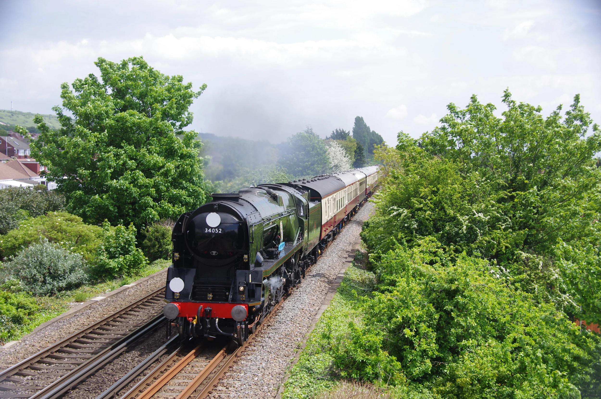 'West Country' No. 34046 Braunton, posing as 'Battle of Britain' No. 34052 Lord Dowding, approaches Portchester with the Clapham-Southampton football special on May 15. Credit: Mervyn Turvey
