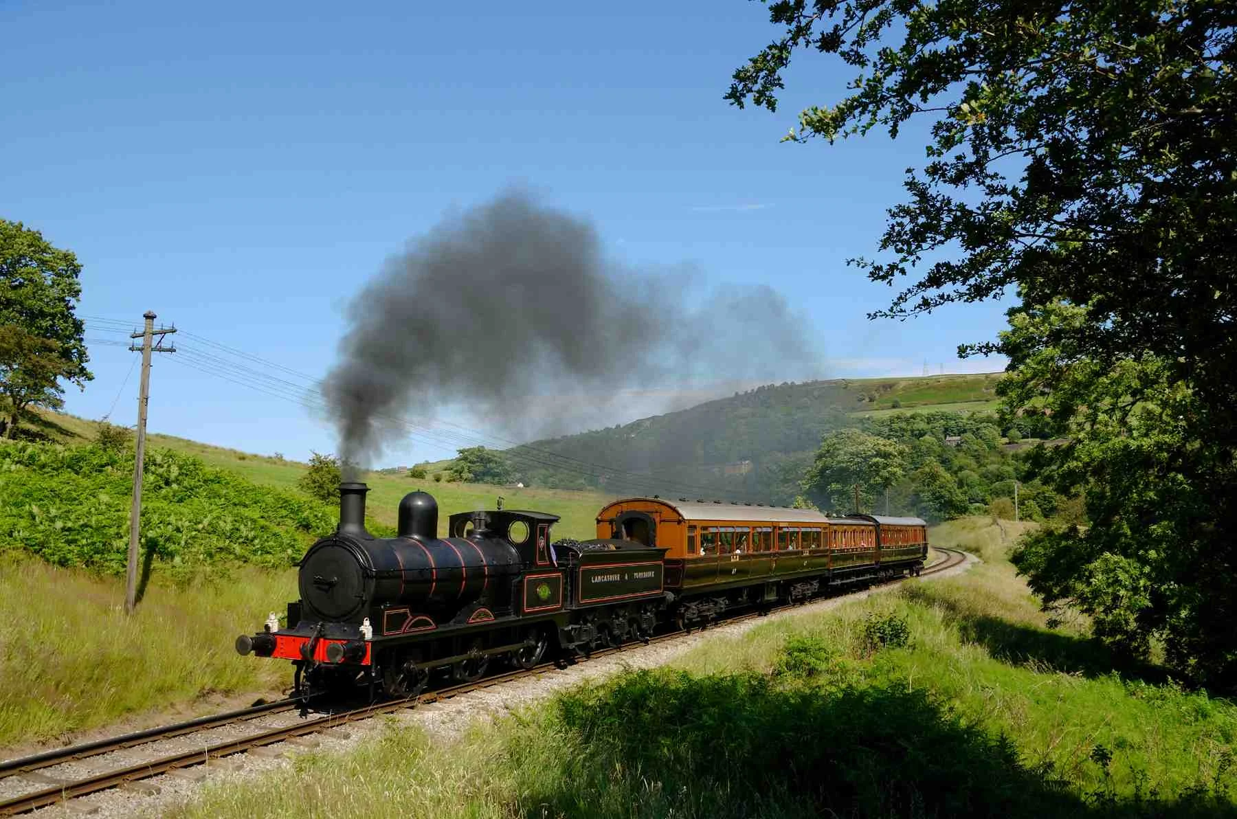 'Ironclad' 0-6-0 No. 957 climbs out of Damems loop with a complete train of Lancashire & Yorkshire Railway carriages on July 22 2012. KARL HEATH