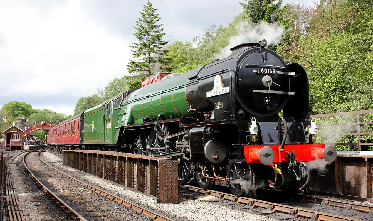 On a previous visit to the NYMR and in BR express passenger green, new-build ‘A1’ No. 60163 Tornado prepares to depart Goathland with a train bound for Pickering. NYMR