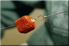 8. Pull the hook all the way through the meat chunk