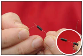 6. Slide a Rig Stop on to reel line, add hooklength swivel then anotherStop