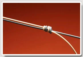 Moisten the knot and pull ends tight so the knot beds down neatly. Choose the loose end pointing towards the point fly as the dropper.