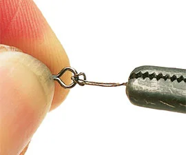 3. Now pass the wire loop back over the swivel and pull it tight. Forceps will help you tighten the loop.