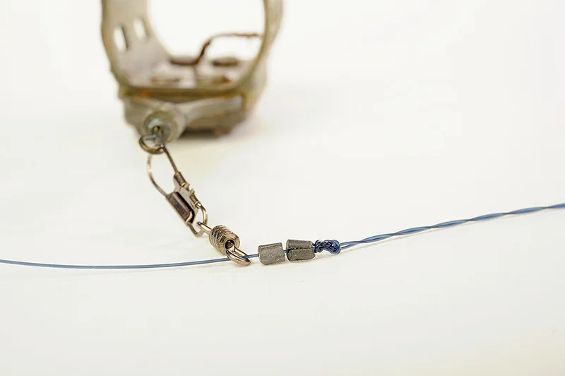 Attach two No8 Stotz to the mainline just above the twisted section, with the feeder above. These butt against the knot and stop the feeder too.