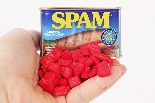 Chop meat into chunks or cubes and then lightly spray on some liquid dye. After a few hours the meat will absorb it. 