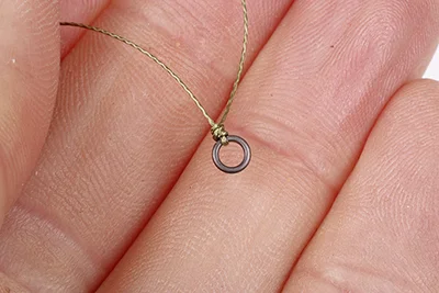 Threaded maggots 3 - Tie a small metal ring to the end of your hooklength.jpg