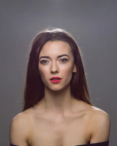 Two lights - butterfly and hair light: Point a light at the subject from behind to give a halo effect around the head. This helps them stand out against the background