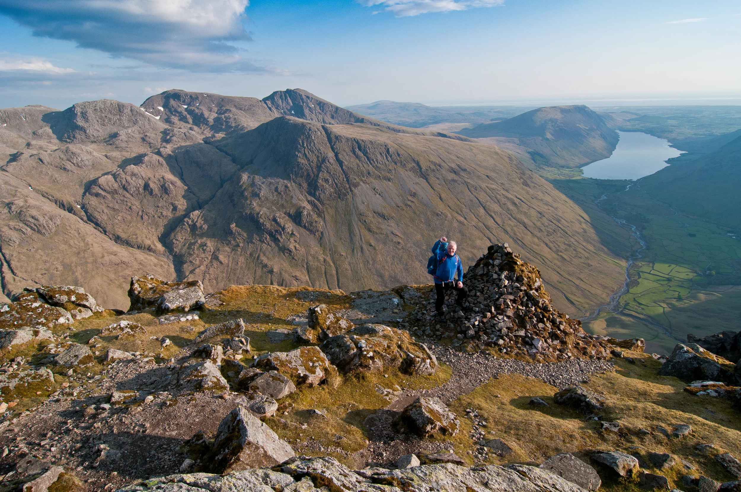 Westmoreland Cairn near the summit of Great Gable in the Lake District, with Wasdale, Scafell and Scafell Pike in the background. Photograph Matthew Roberts / Trail Magazine