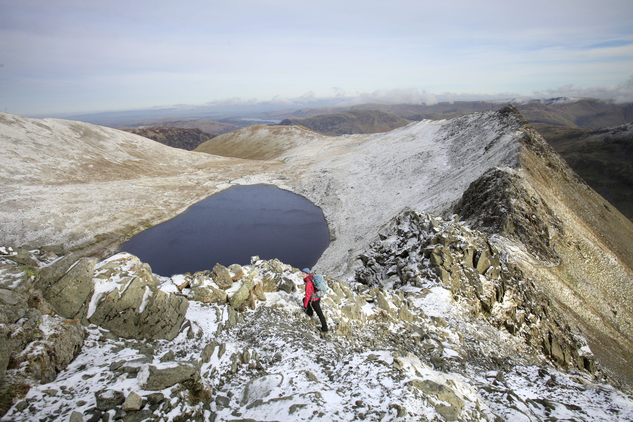 Red Tarn, beneath Striding Edge on Helvellyn. Photo : Tom Bailey © Trail Magazine