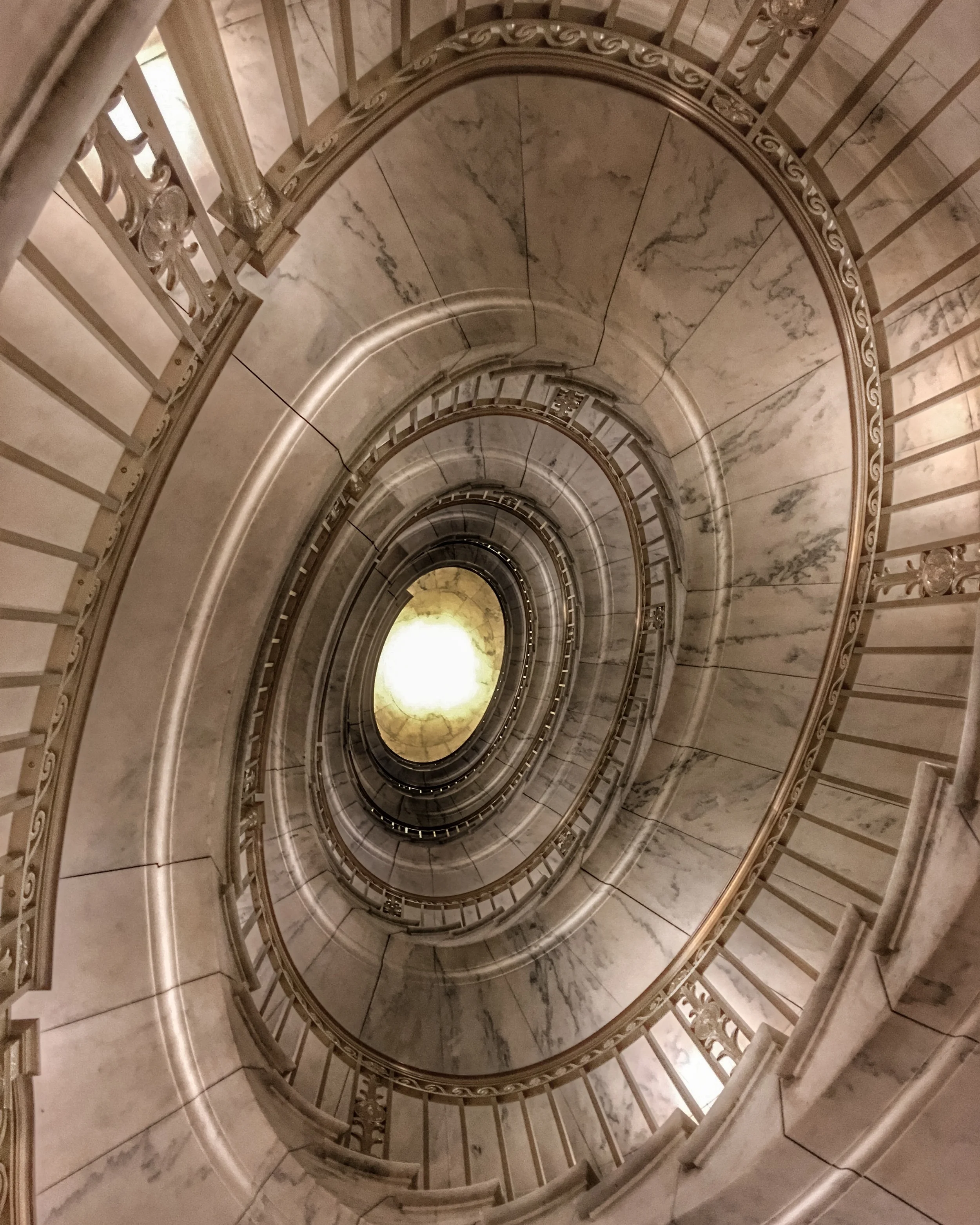The US Supreme Court building features two self-supporting marble spiral staircases. Touring the building is free, as is attending oral arguments in the courtroom (seating is extremely limited and done on a first-come, first-served basis).
