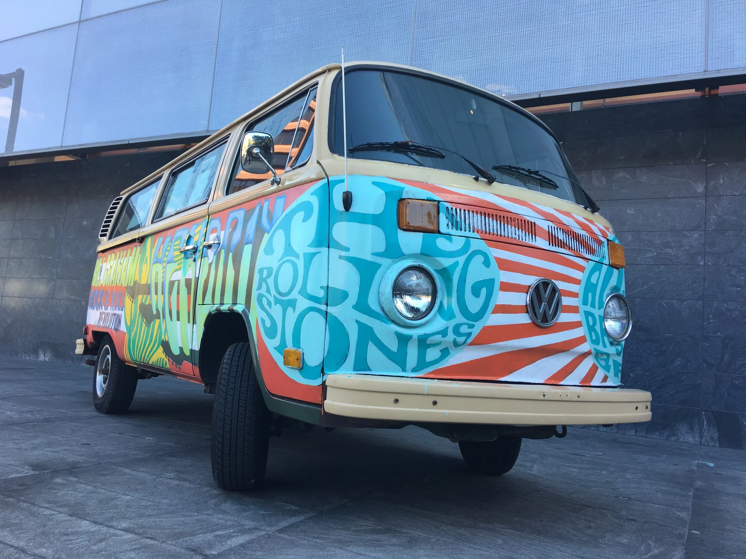 Hand-painted VW bus announcing the Bill Graham: Rock & Roll Revolution exhibit.