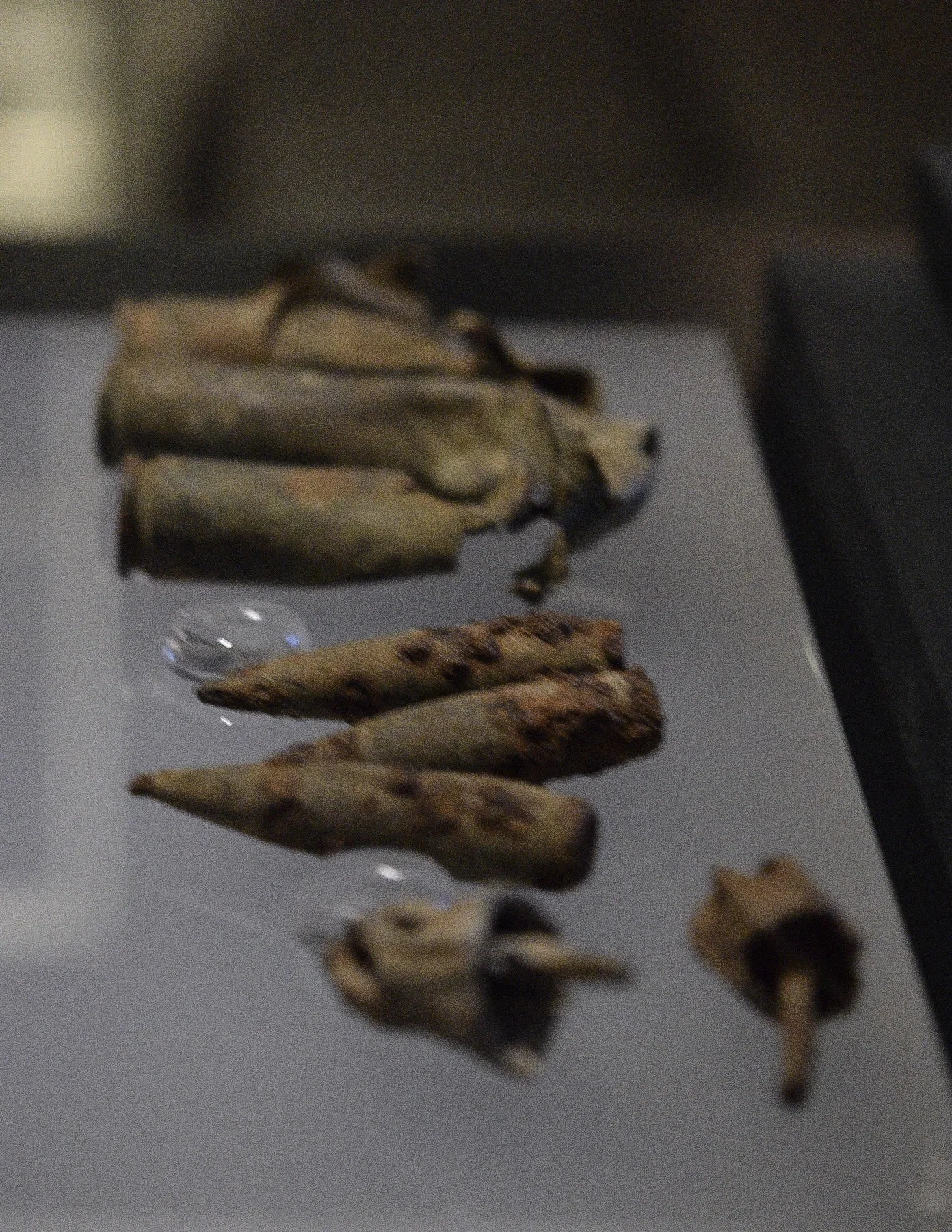 Handmade dreidels and bullets, found in one of the camp’s mass graves