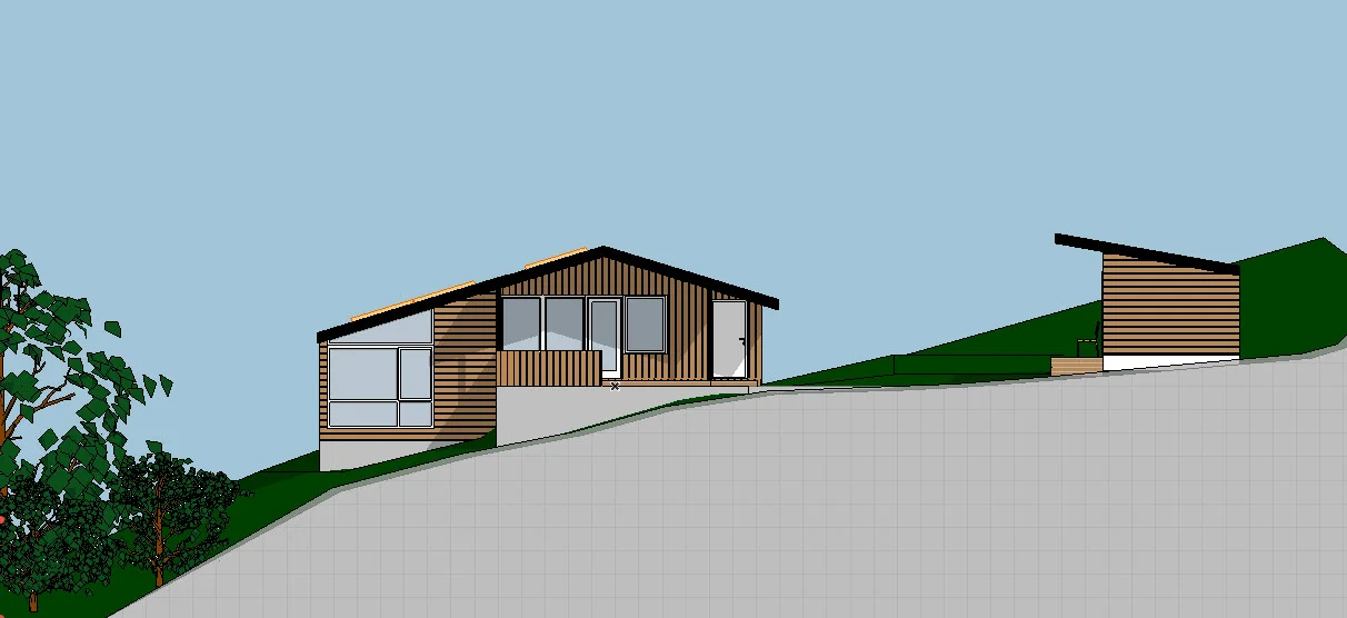 Hytte fasade mot nord med himmel.jpg