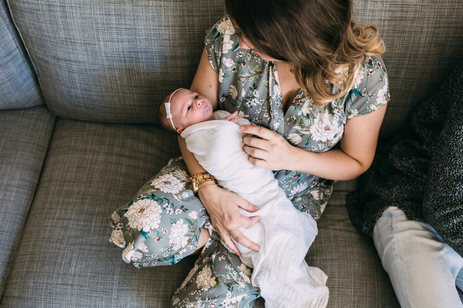  1 week old baby girl in mother's arms wide awake - uxbridge family photography