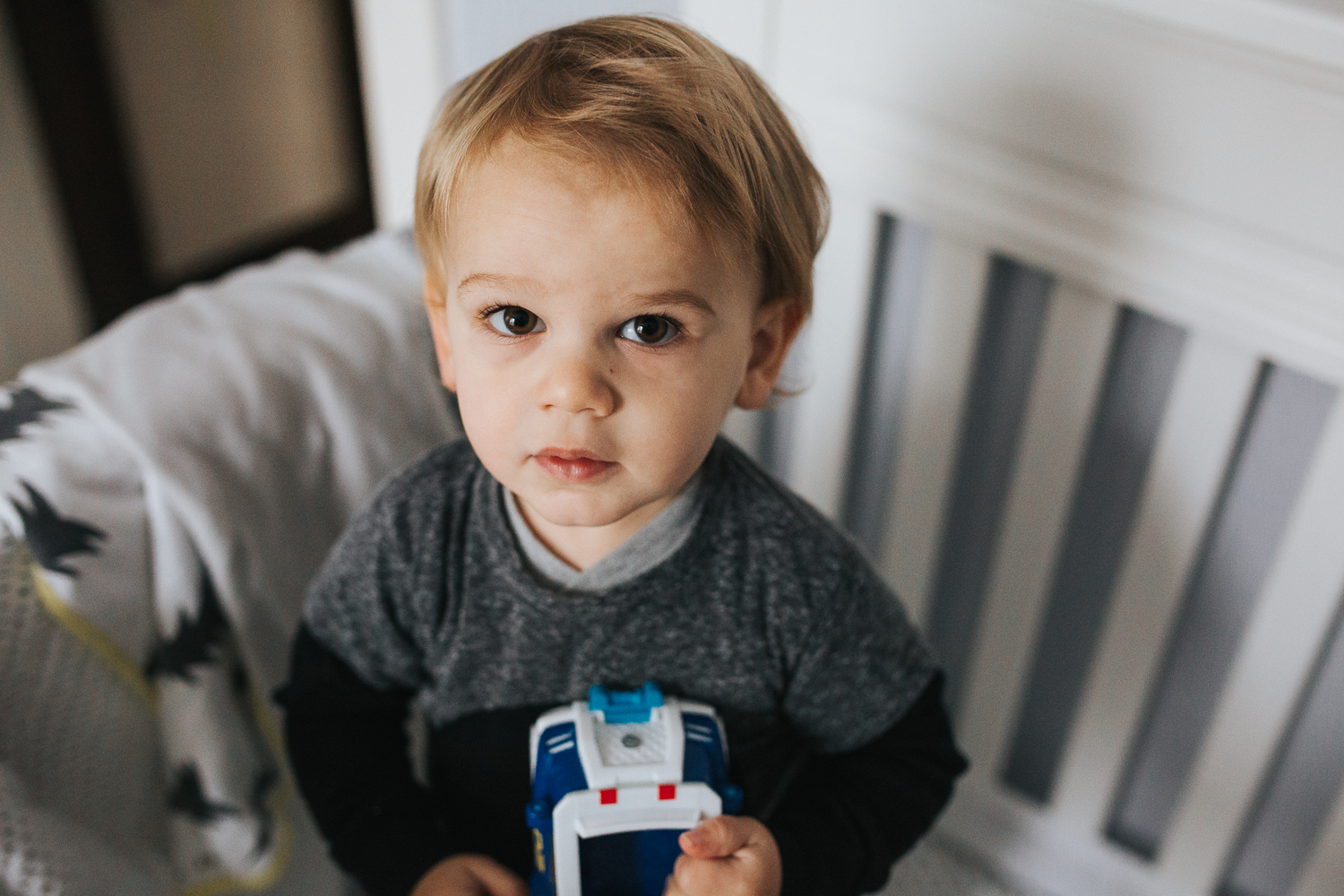 2 year old toddler boy in crib {Toronto Family Photographer}