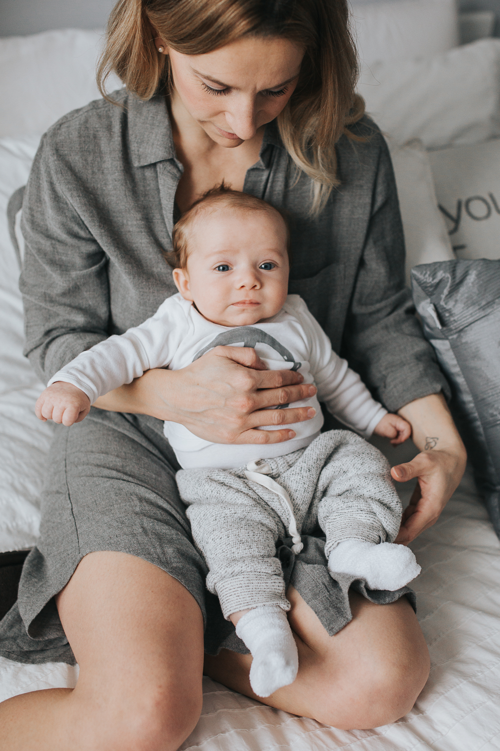 Mom and 2 month old baby boy on bed {Toronto Family Photographer}