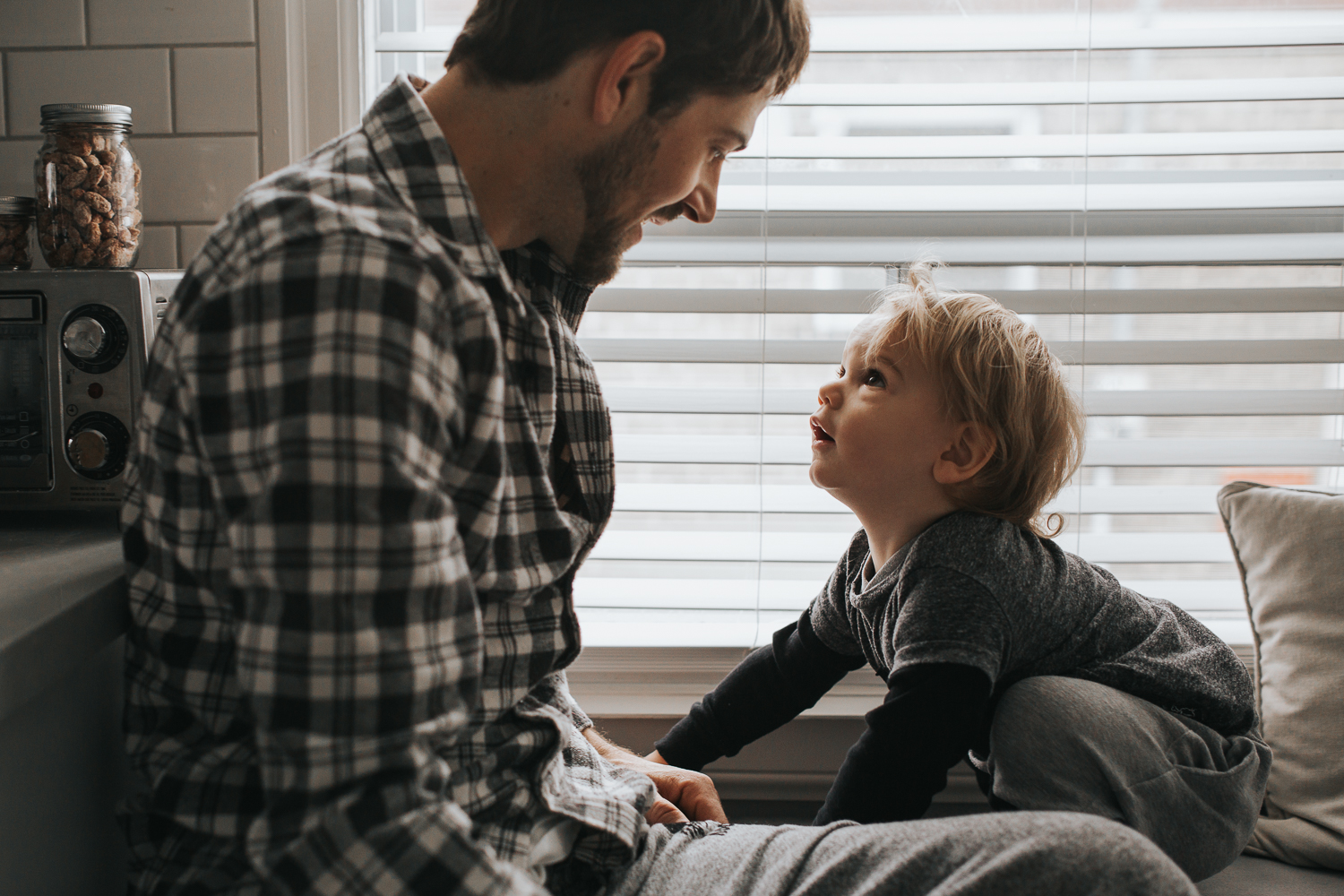 Dad and 2 year old toddler boy looking at each other {Toronto Family Photographer}