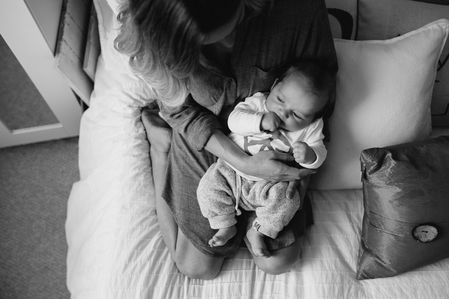 Mom and 2 month old baby boy on bed {Toronto Family Photographer}