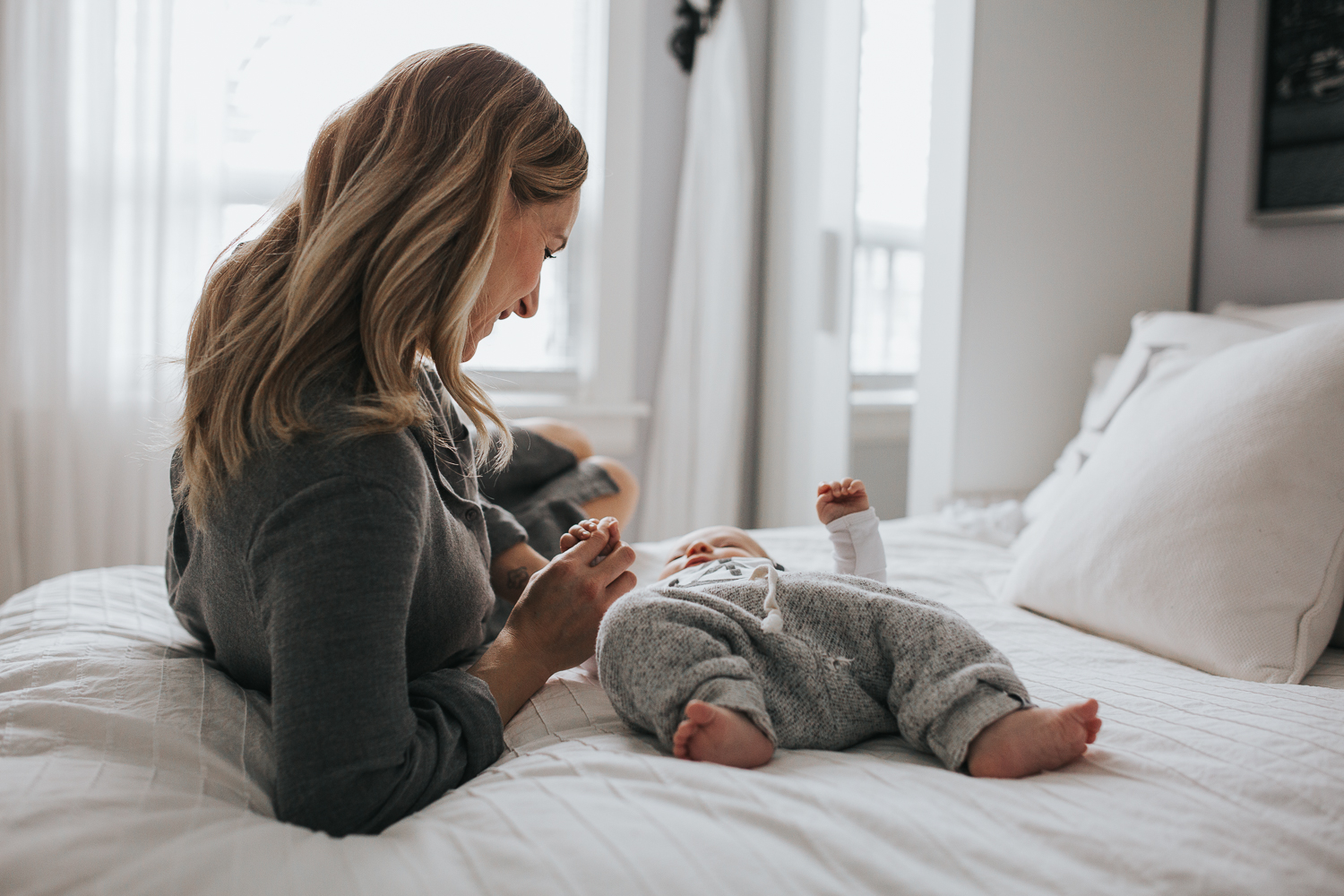 Mom and 2 month old baby boy on bed {Toronto Family Photographer}