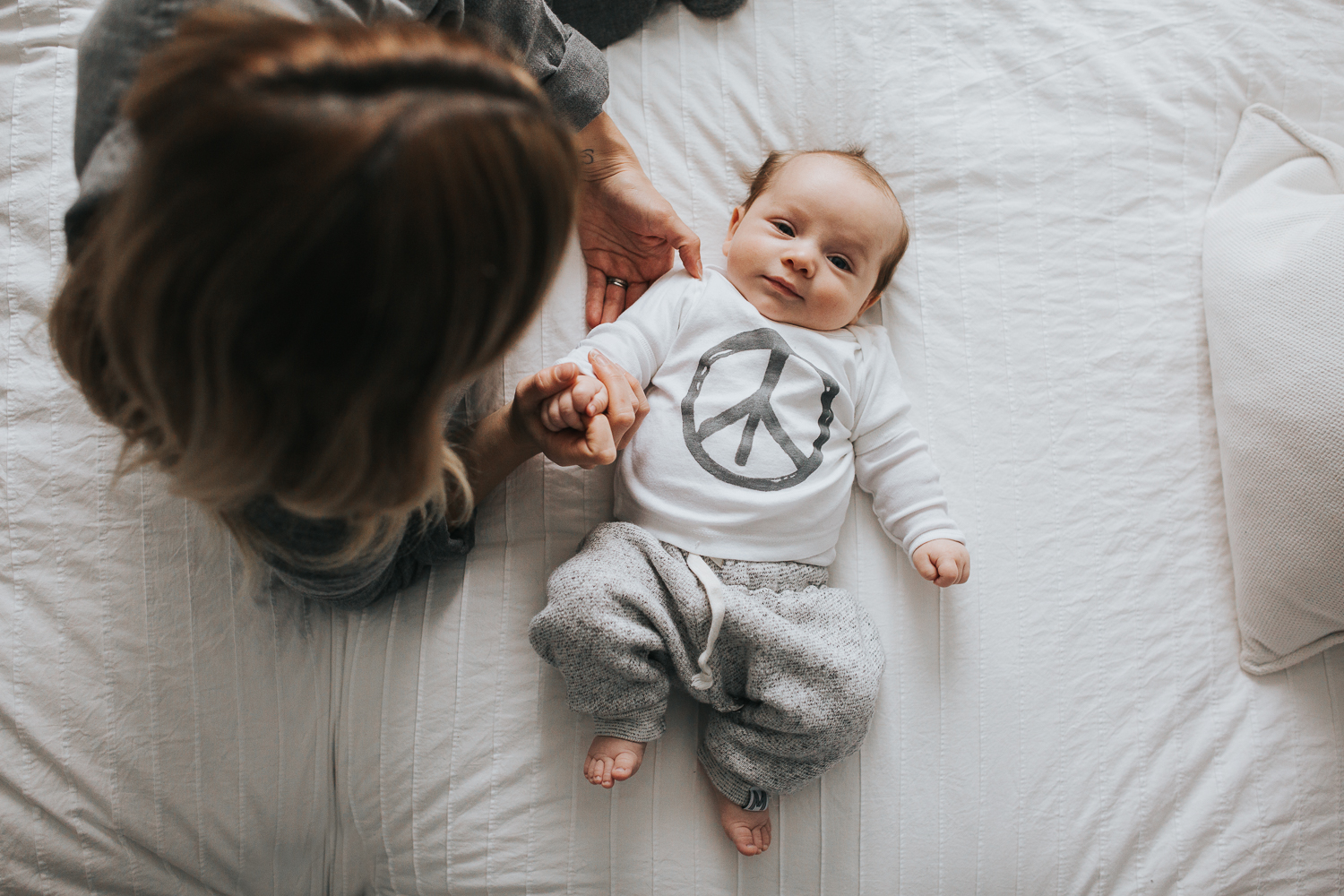 Mom and 2 month old baby boy on bed {Toronto Family Photographer}