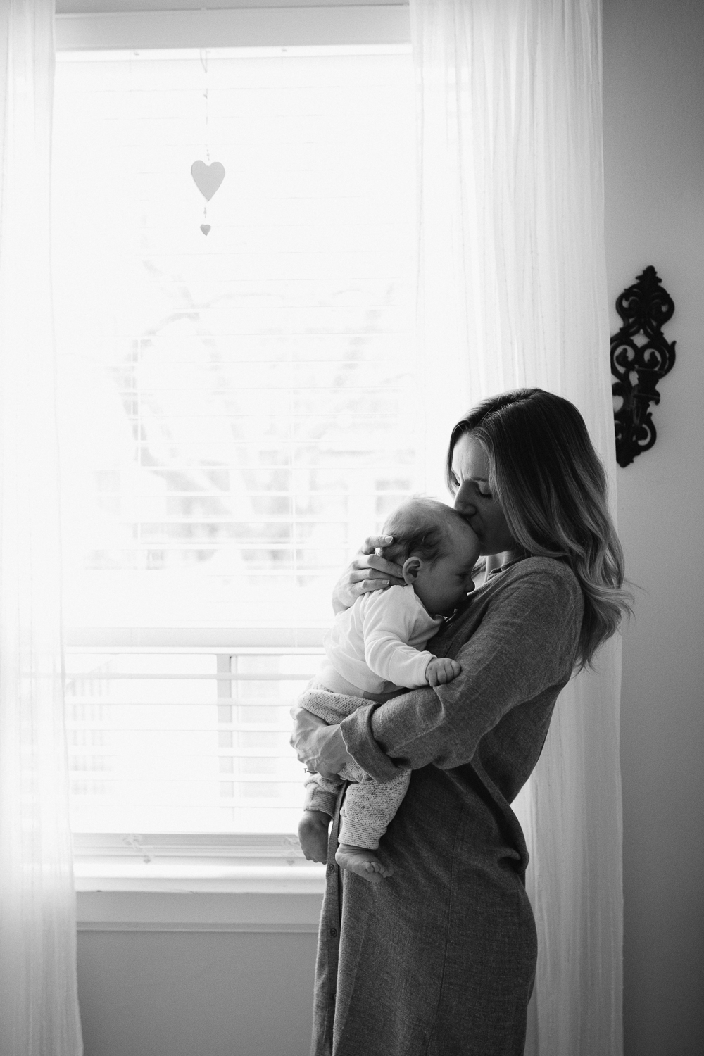 Mom kissing 2 month old baby boy {Toronto Family Photographer}