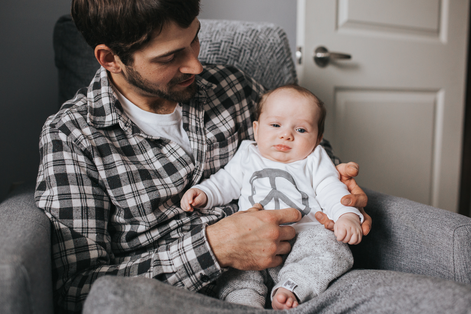 Dad and 2 month old baby boy sitting on chair {Toronto Family Photographer}