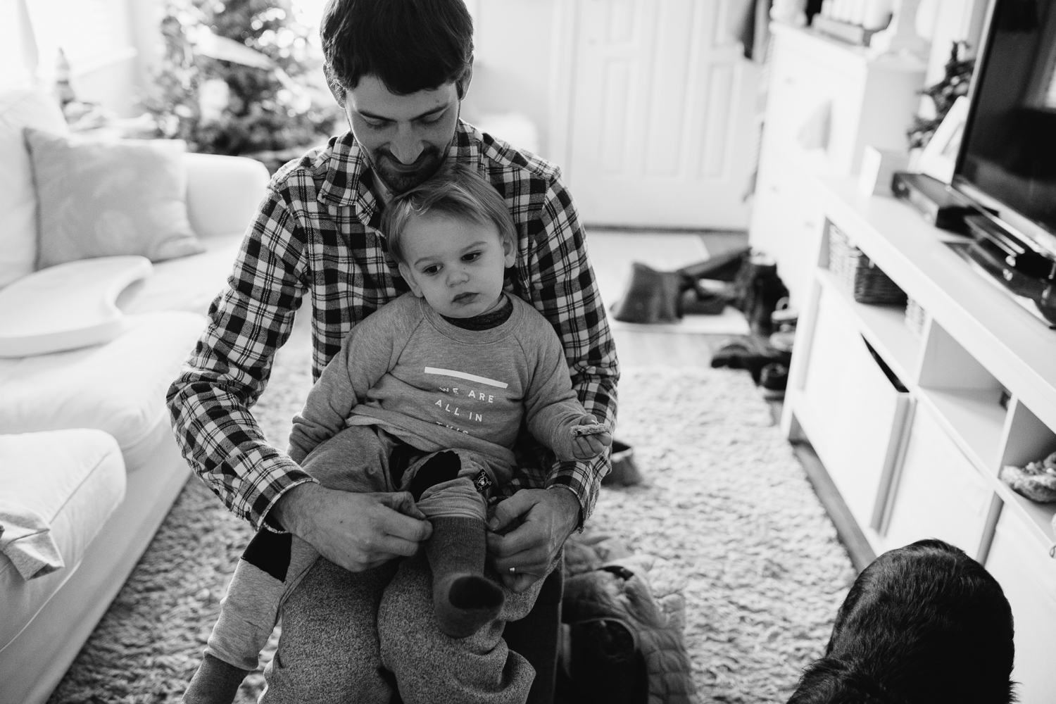 2 year old toddler boy getting dressed with dad {Toronto Family Photographer}