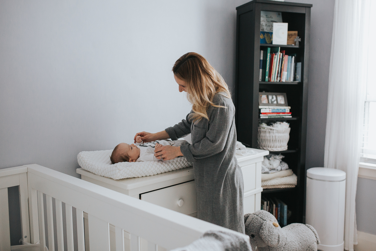 2 month old baby boy on changing table with mom {Toronto Family Photographer}