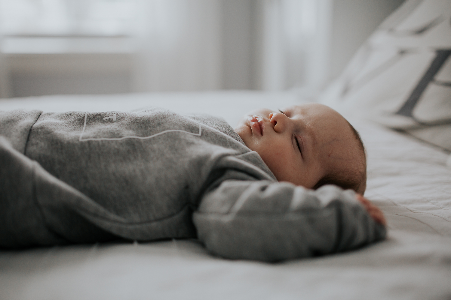 2 month old baby boy lying on bed {Toronto Family Photographer}