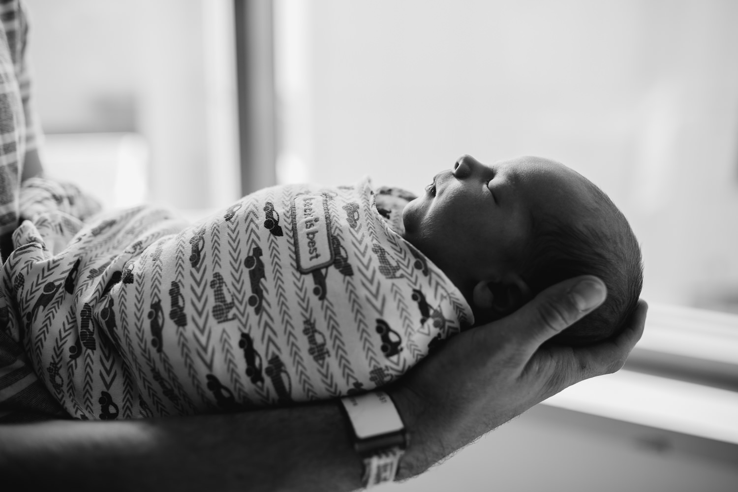 newborn baby boy held by dad - Newmarket baby photos