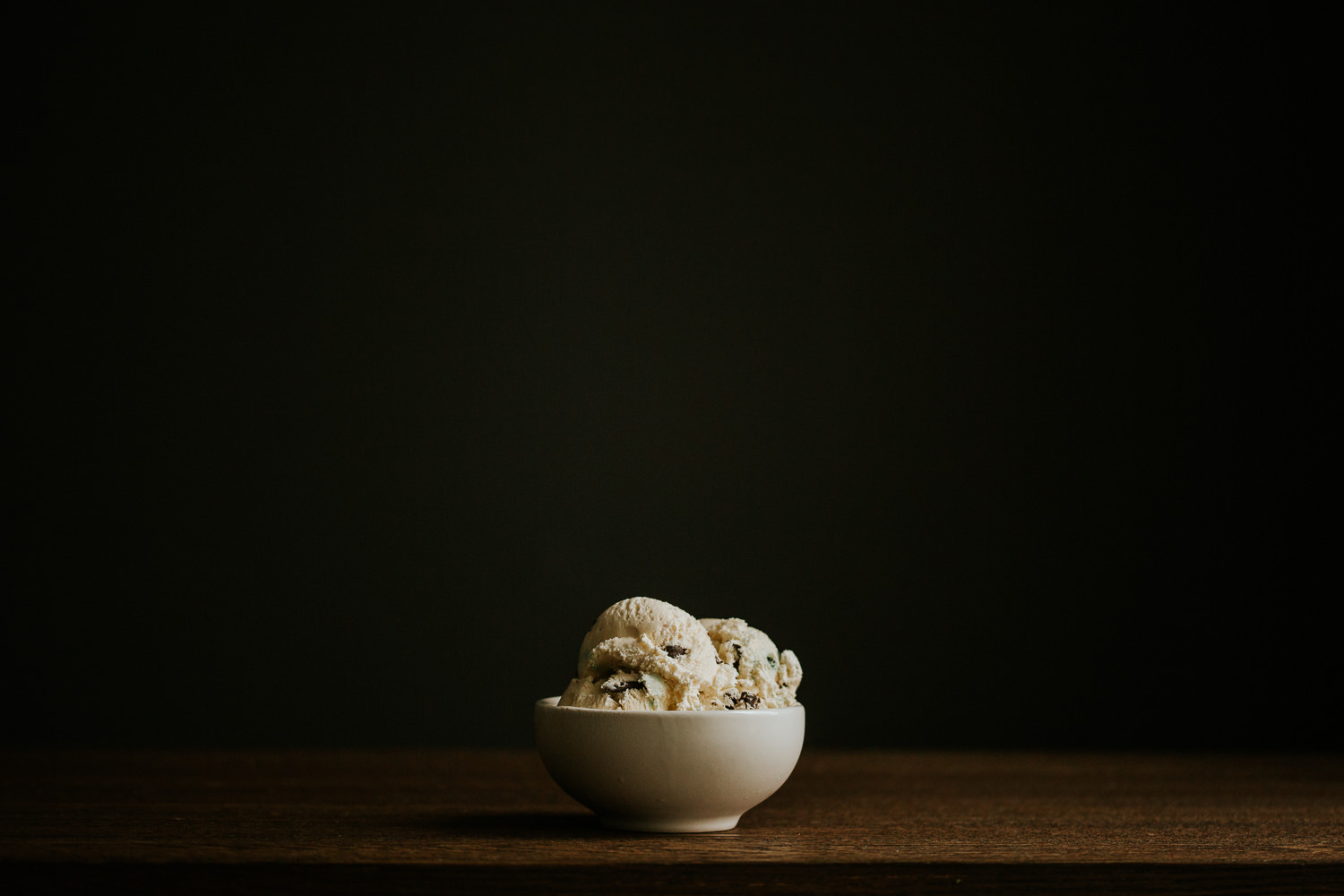 candy cane ice cream in white bowl on wood table - Toronto food photography
