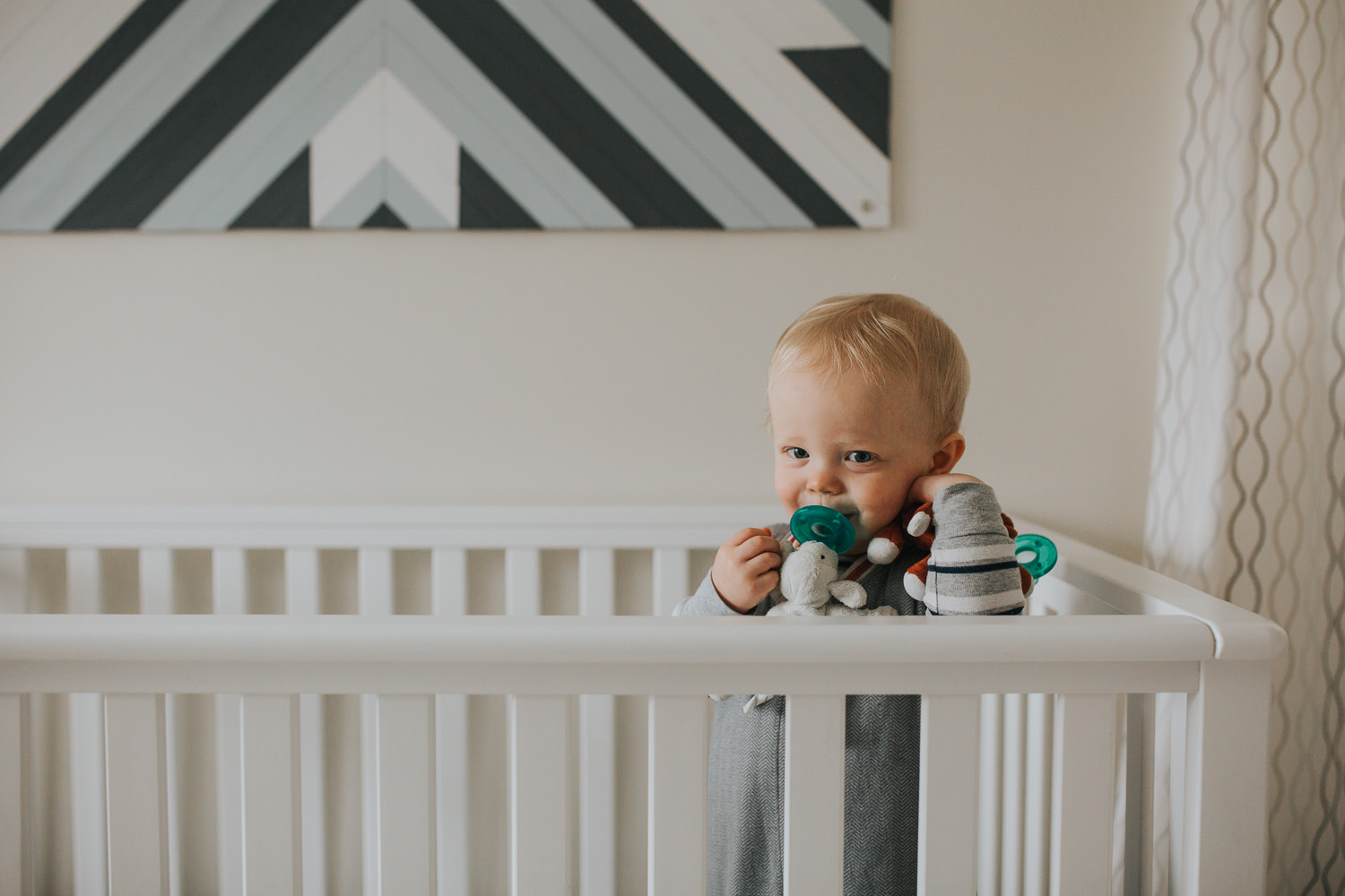 1 year old toddler boy in crib with soother - Uxbridge baby photos