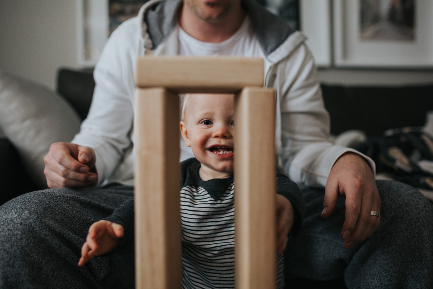 1 year old baby boy playing with wood blocks with father - Newmarket lifestyle photography