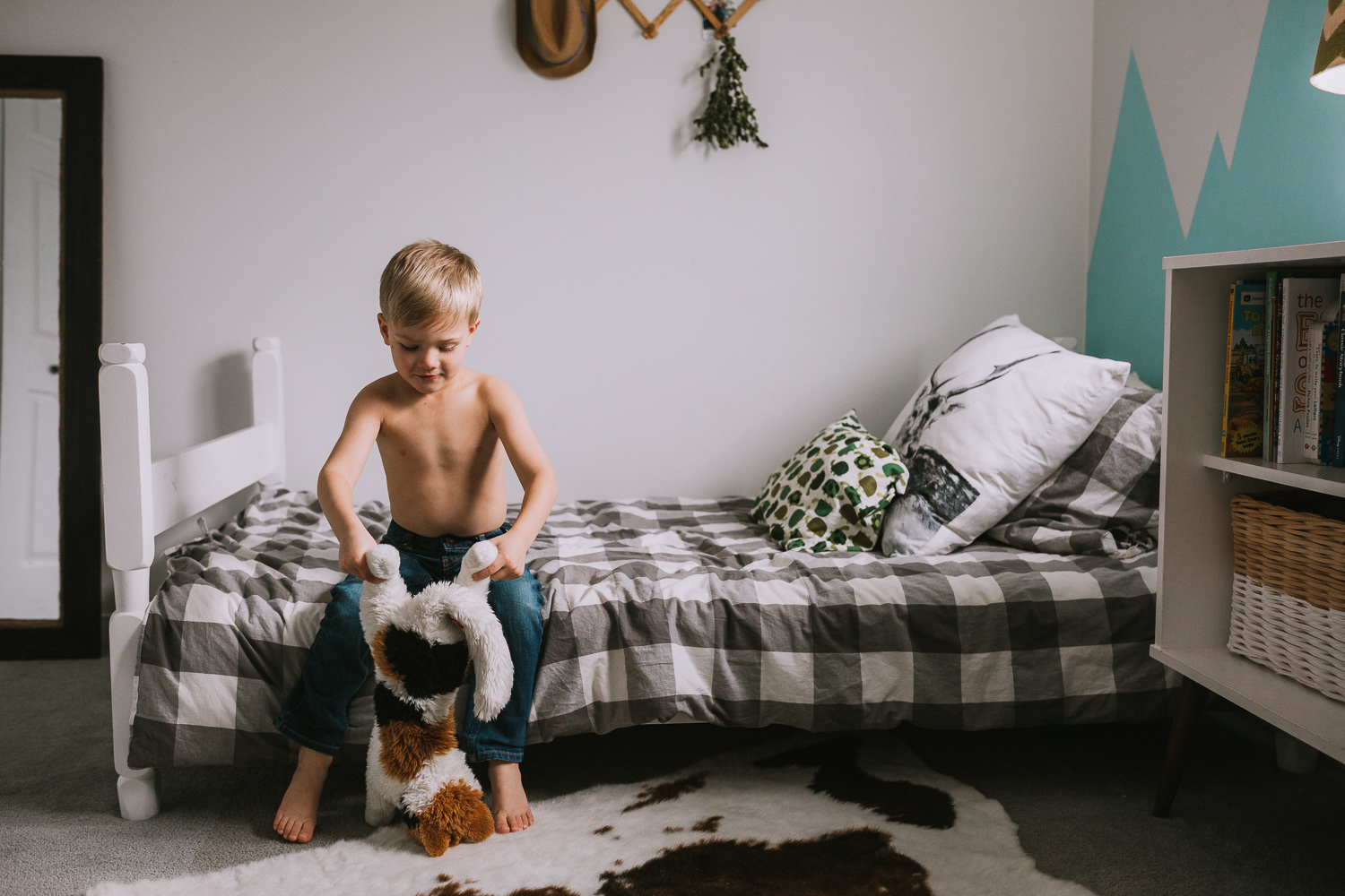 5 year old blonde boy playing with stuffed animal in bedroom - Uxbridge family photography