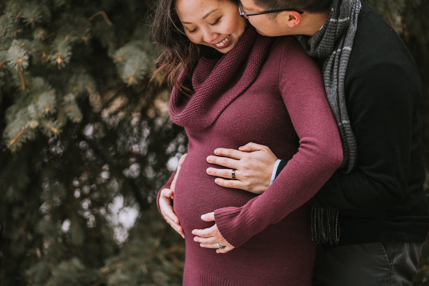 pregnant woman smiling as husband kisses her on cheek - Uxbridge lifestyle photography