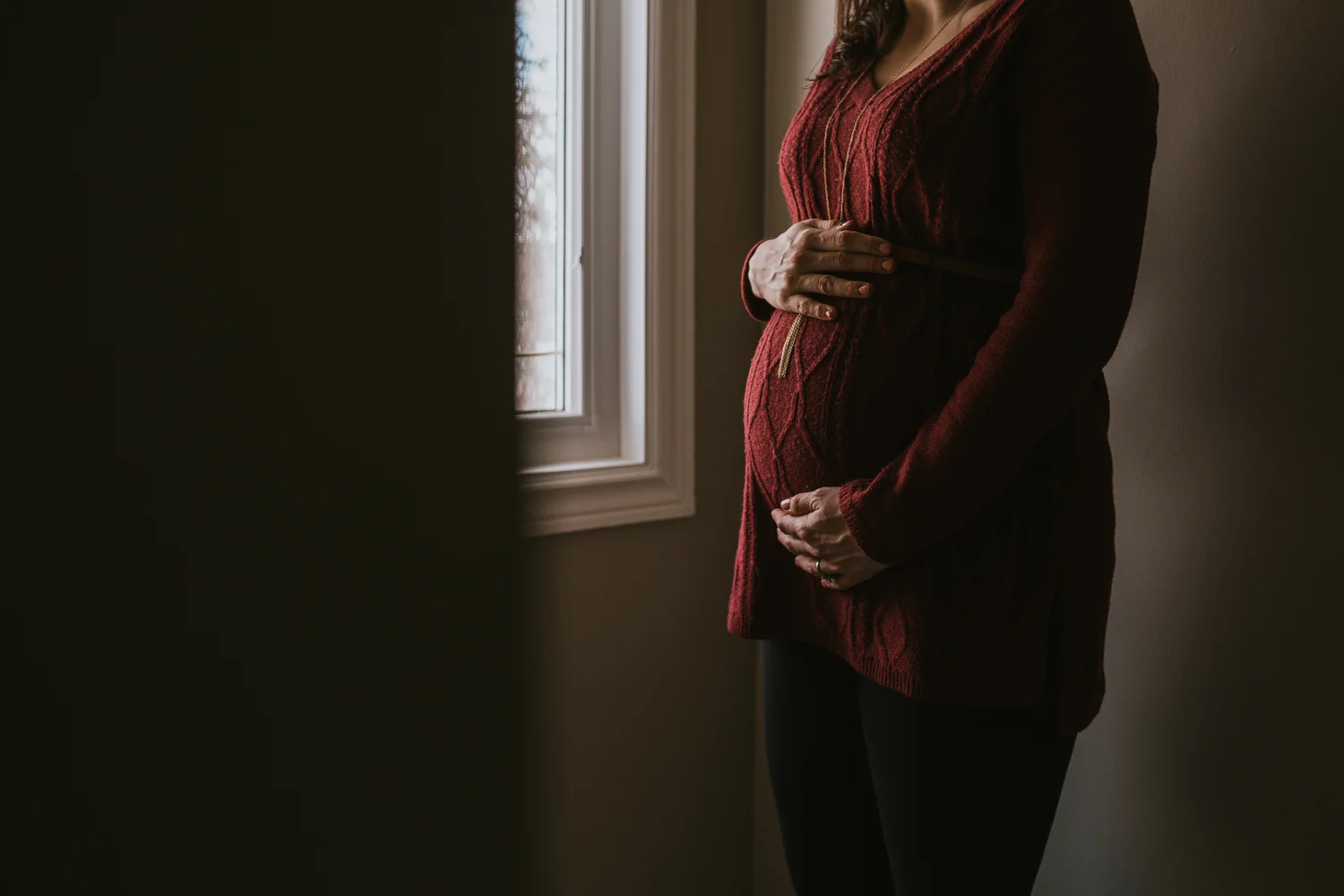 pregnant mother to be holding baby bump - Newmarket Lifestyle Photography