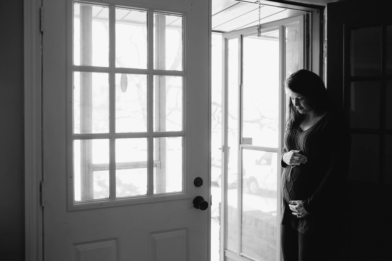pregnant mother to be looking at baby bump - Stouffville Lifestyle Photography