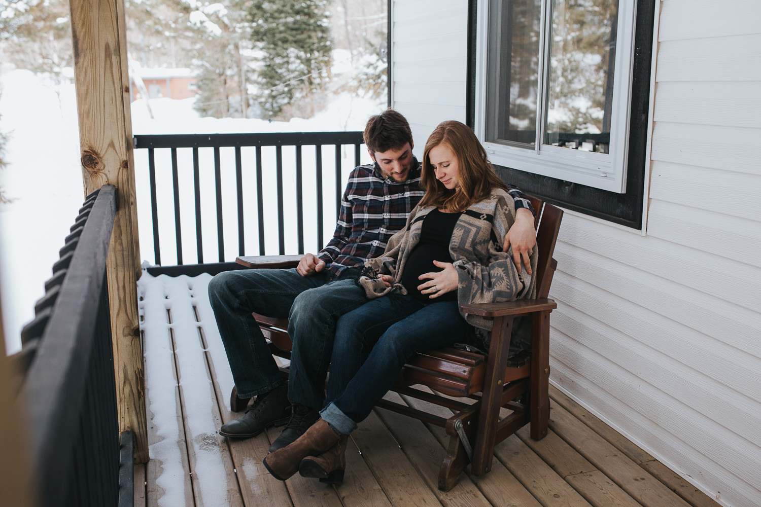 parents to be sitting on front porch looking at wife's baby bump - Newmarket lifestyle photography