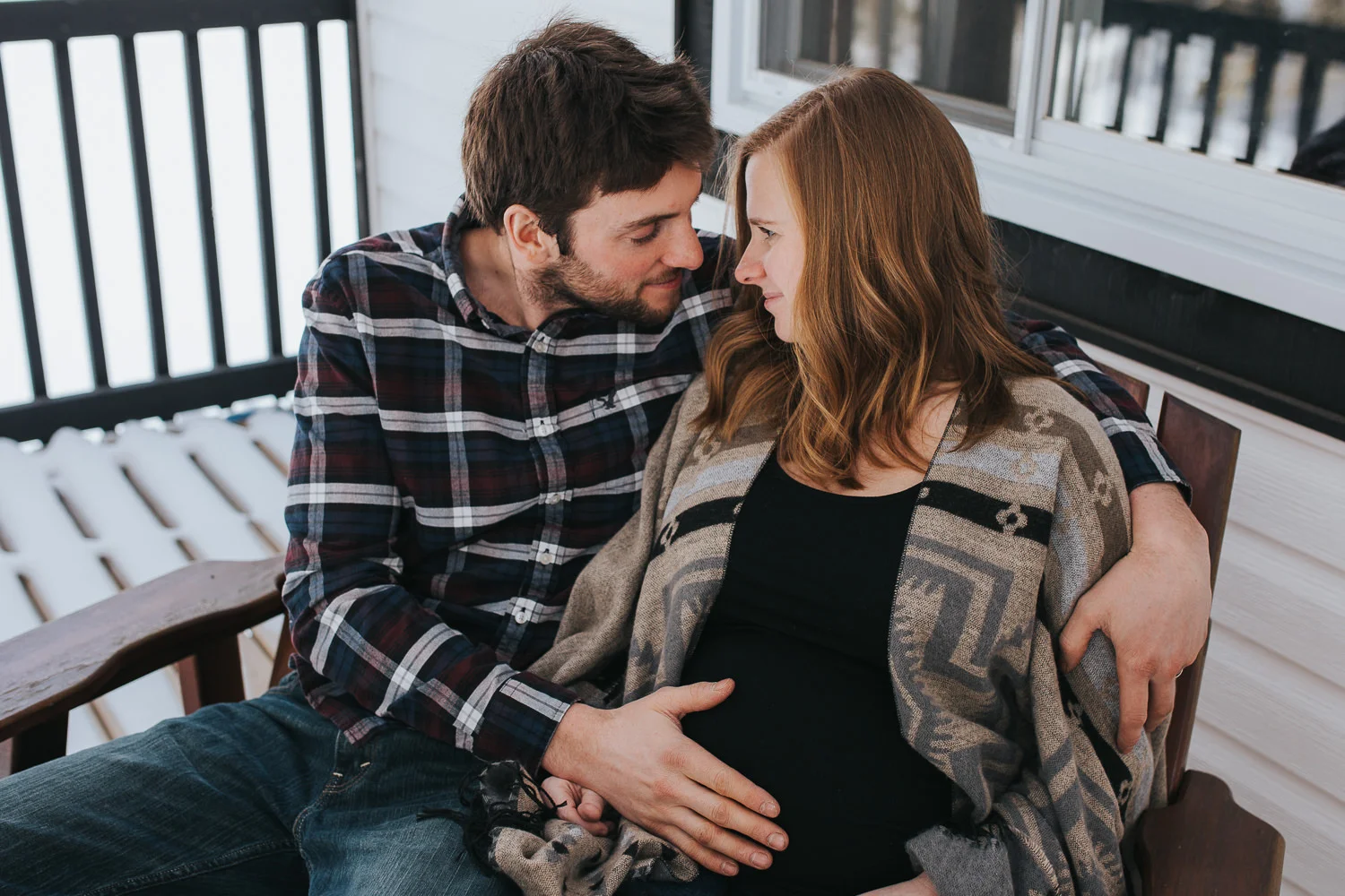 parents to be sitting on front porch husband touching wife's baby bump - Uxbridge lifestyle photography