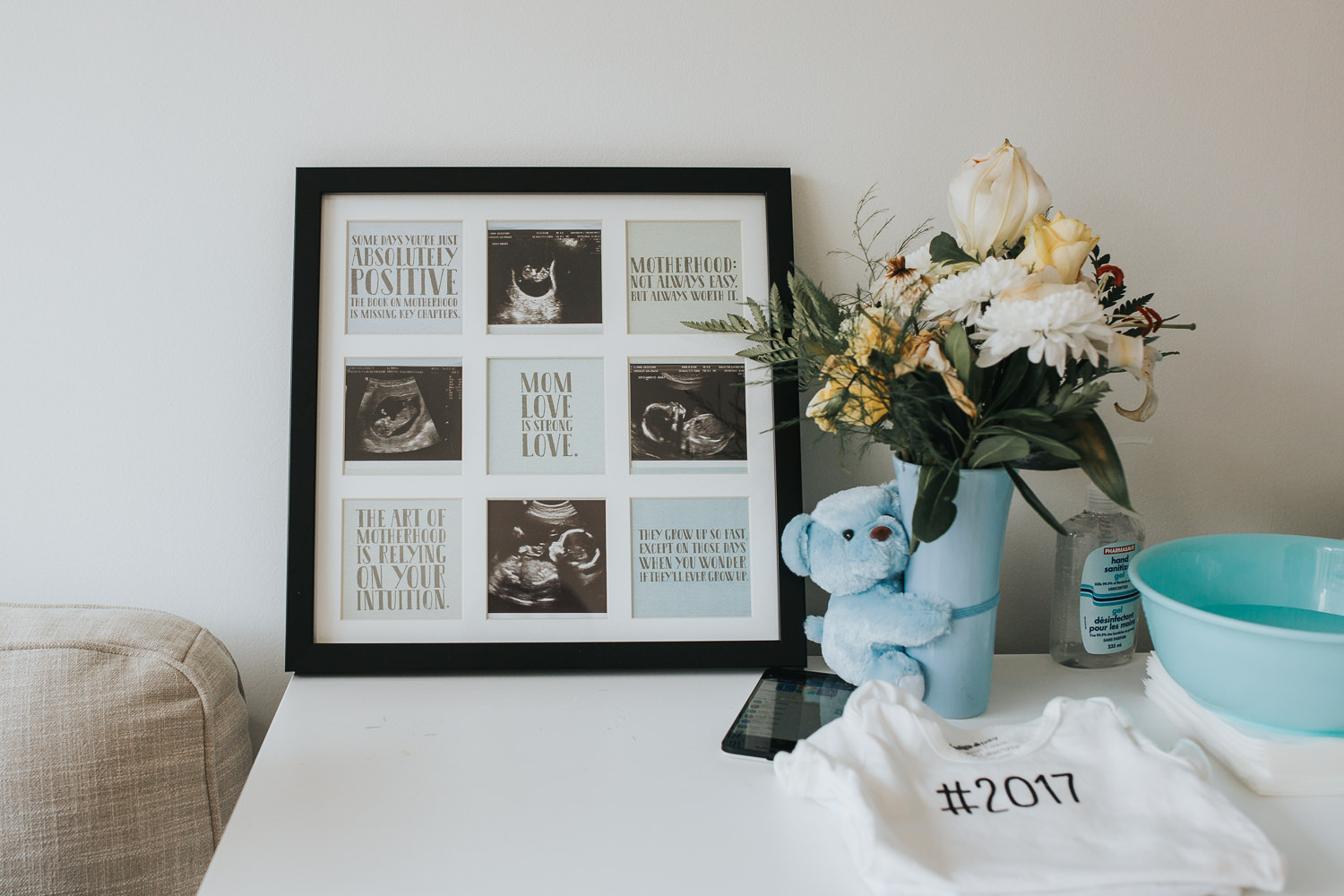 nursery details, picture frame with ultrasound pictures inside, blue teddy bear, flowers - Stouffville in-home photos