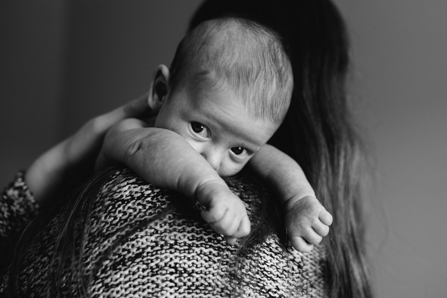 6 week old baby girl peeking over mom's shoulder - Newmarket lifestyle photos