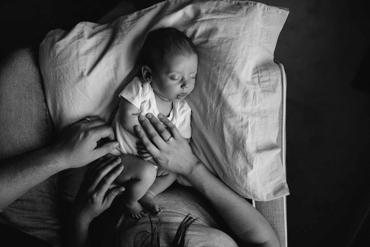 6 week old baby girl asleep on nursing pillow in mother's lap - Newmarket lifestyle photos