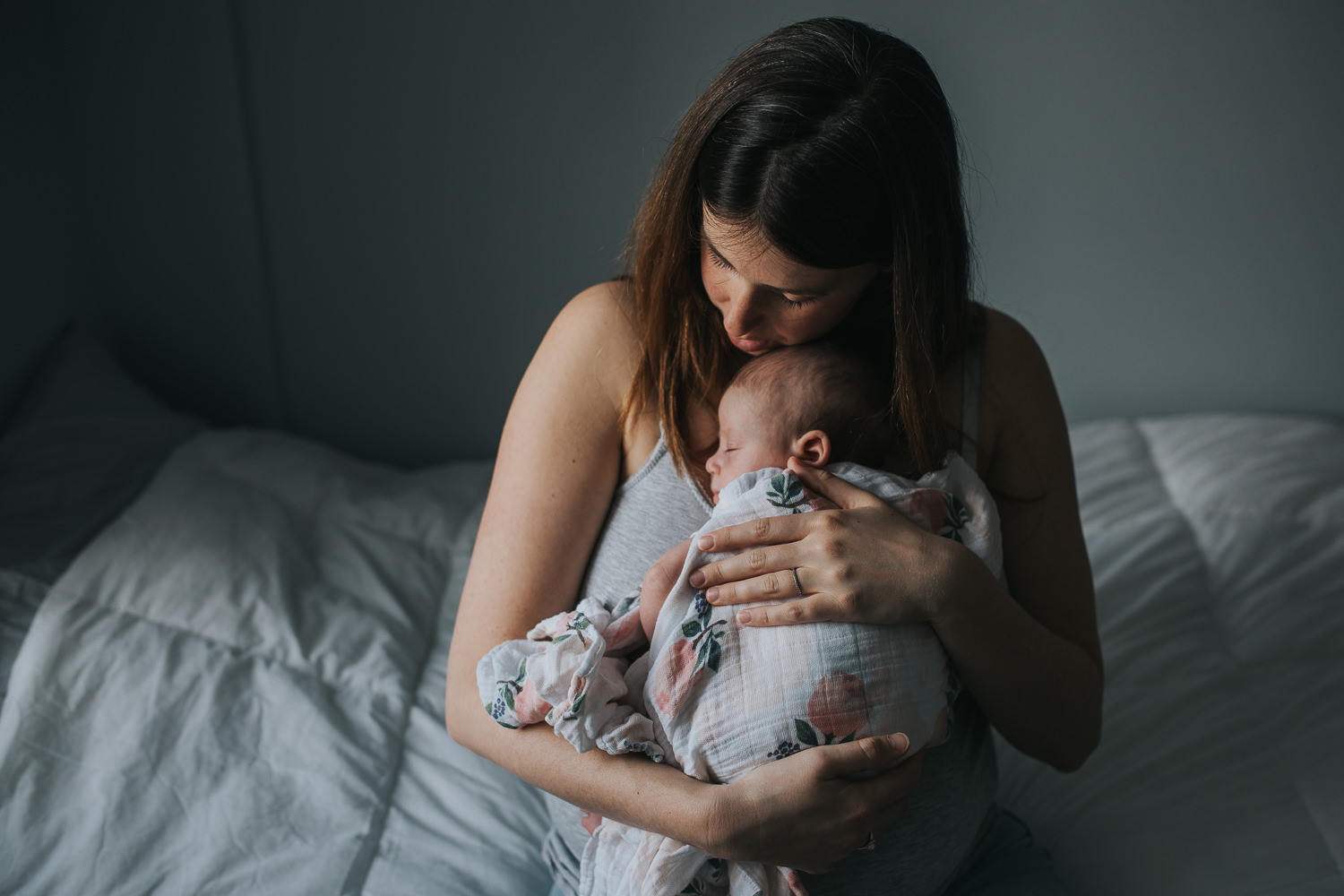 new mom holding 6 week old baby girl to chest - Markham lifestyle photography