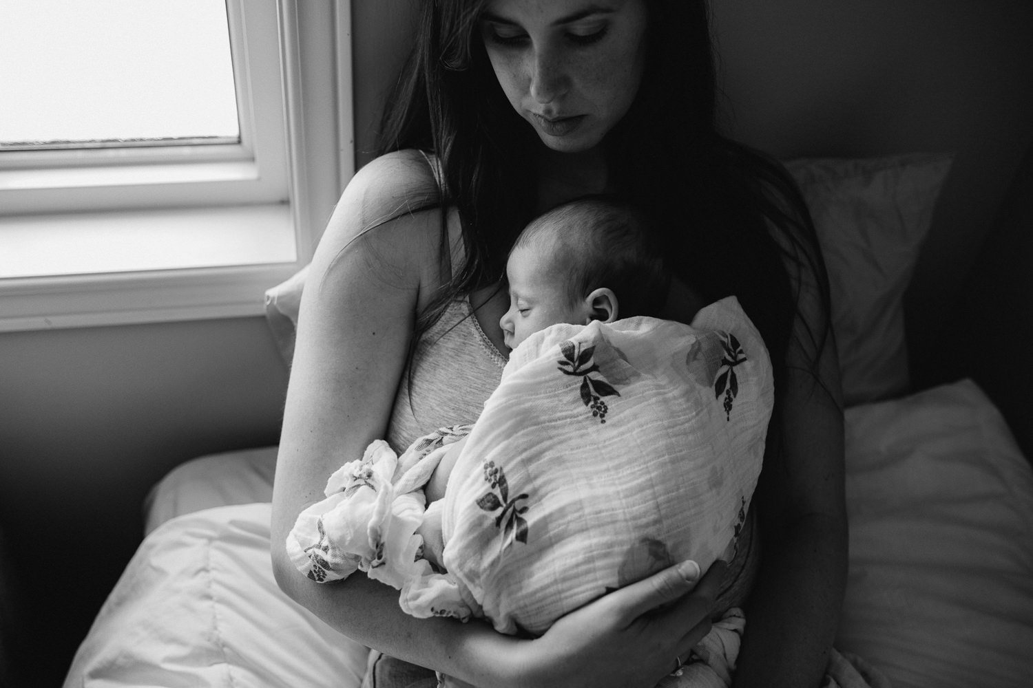 new mom holding 6 week old baby girl to chest - Newmarket lifestyle photography