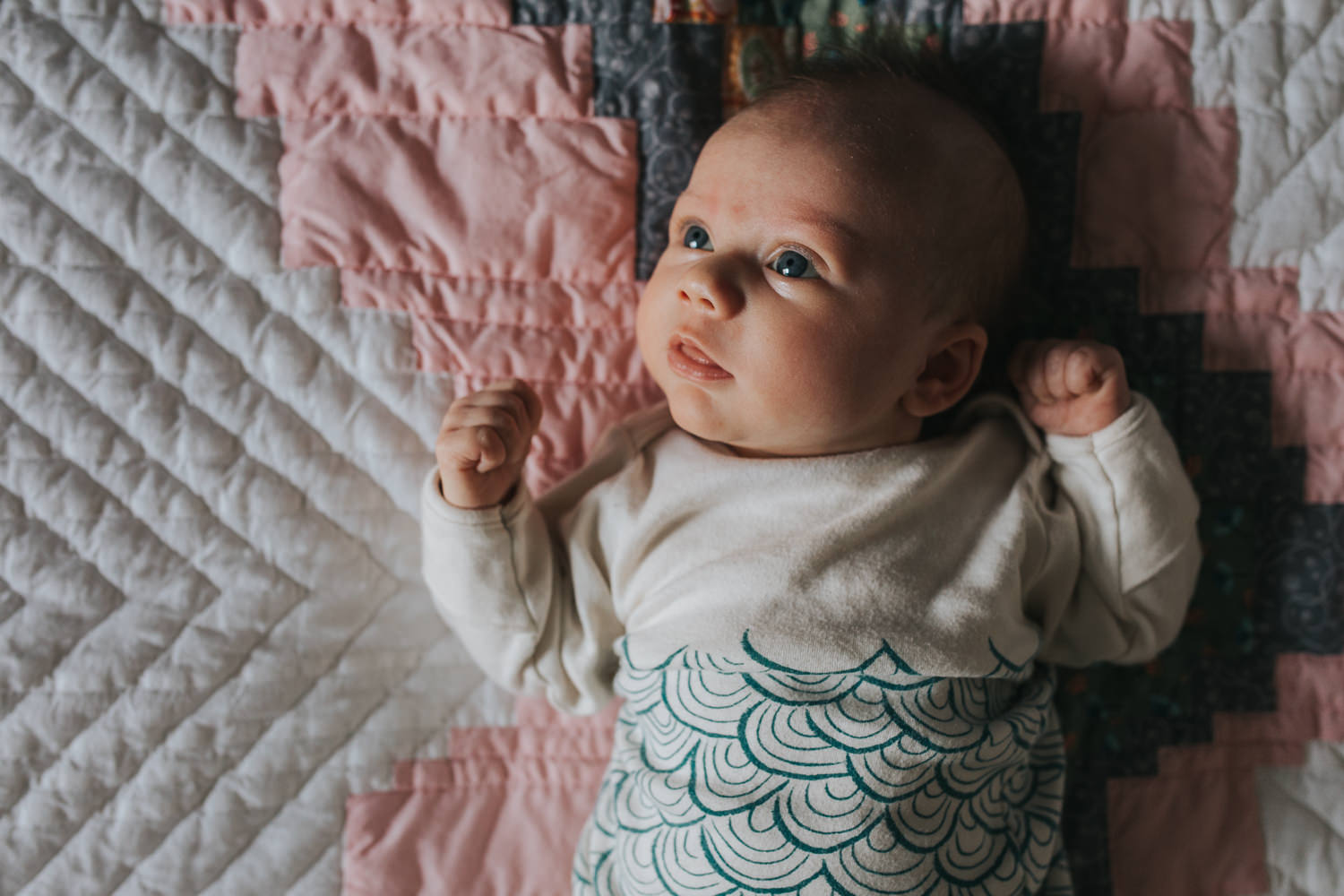 5 week old awake baby girl lying on handmade quilt - Newmarket lifestyle photos