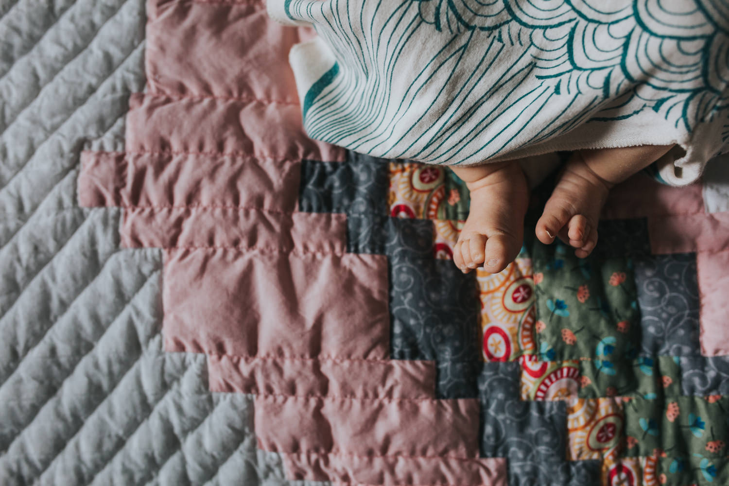 close-up of baby girl feet lying on handmade quilt - Stouffville lifestyle photos