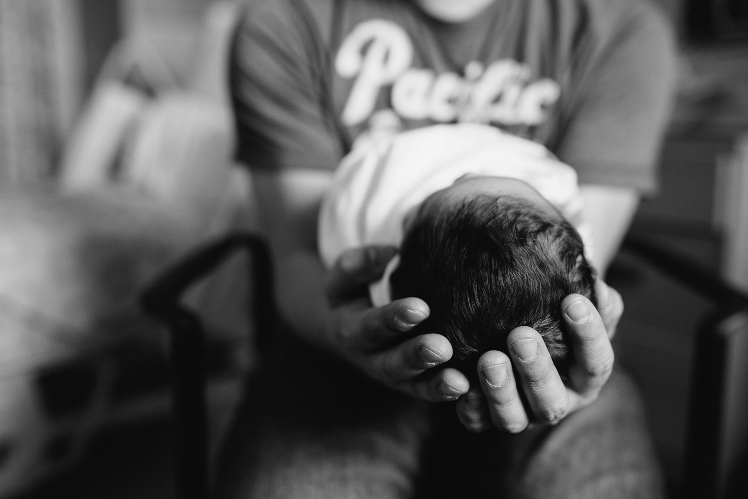 new dad holding 1 day old baby boy's head in hands - Markham Fresh 48 Photography